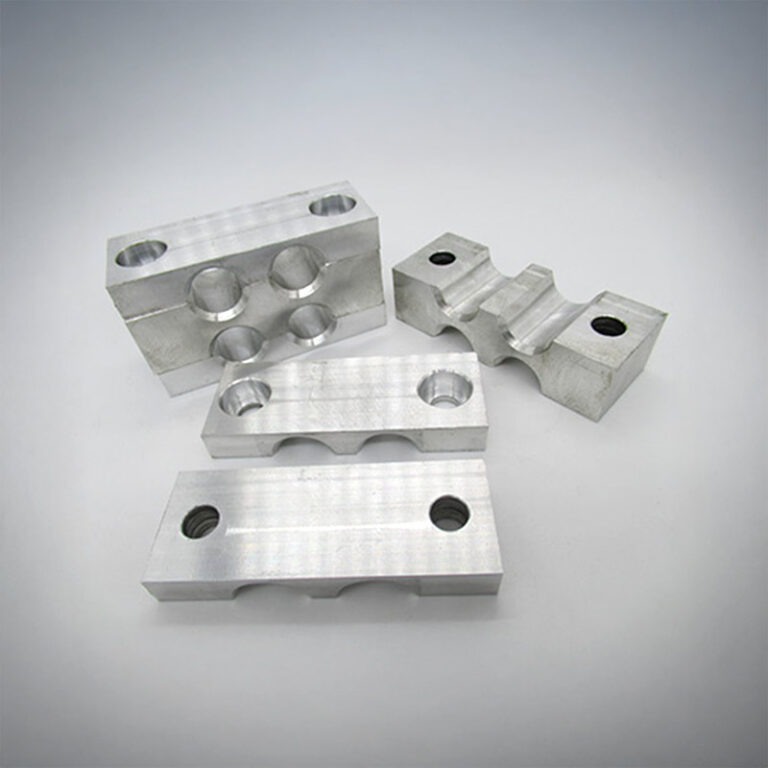 Four CNC-milled parts with special contour