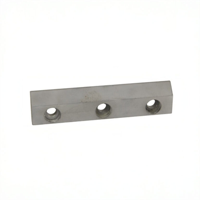 Elongated milled part with three bores