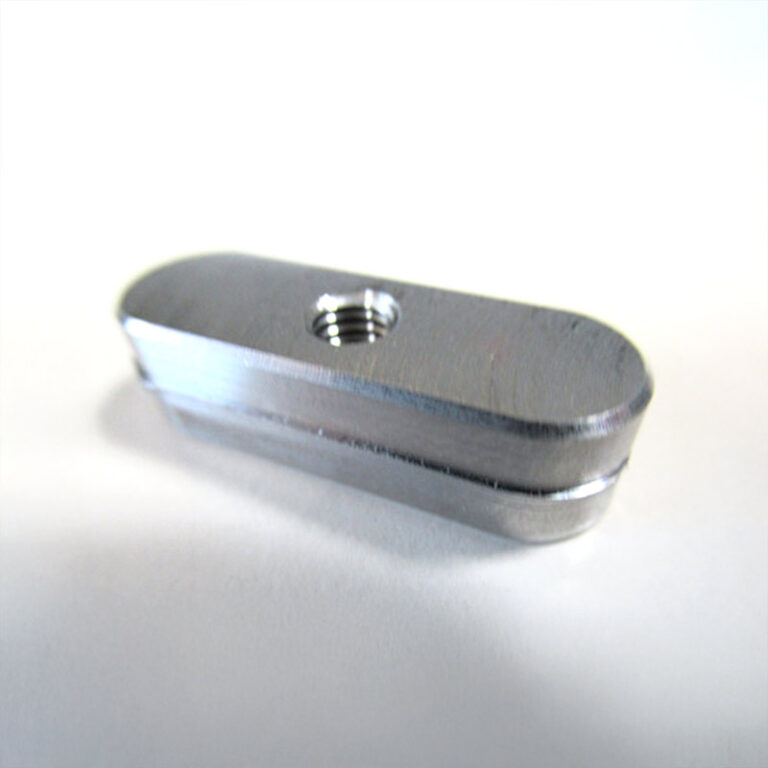 Milled part with central thread and rounded ends