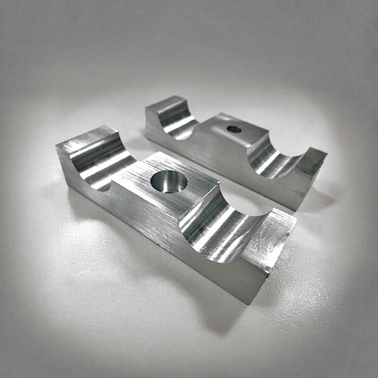 Two shaped aluminium parts with concave millings