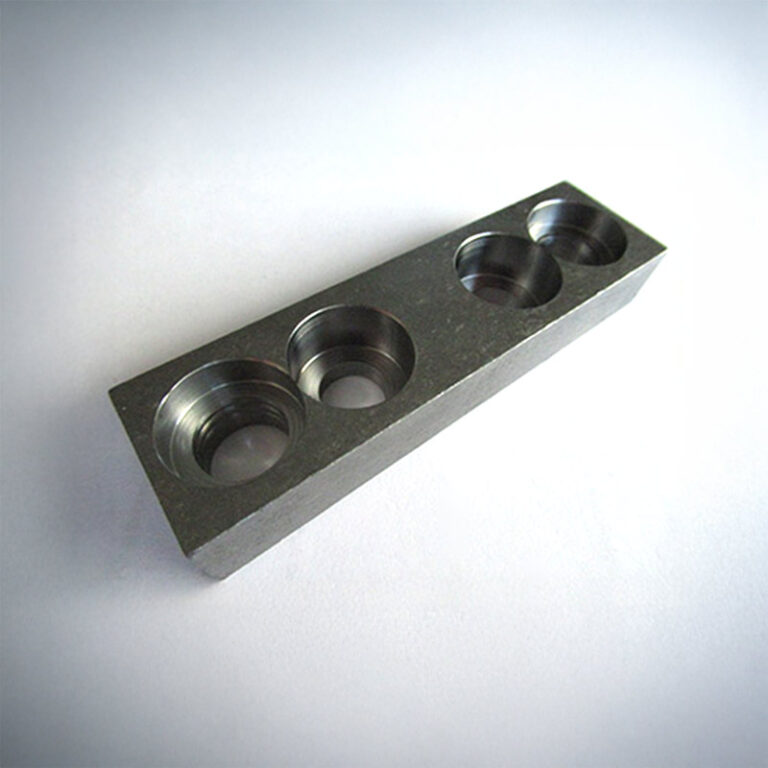 Rectangular milled block with multiple bores